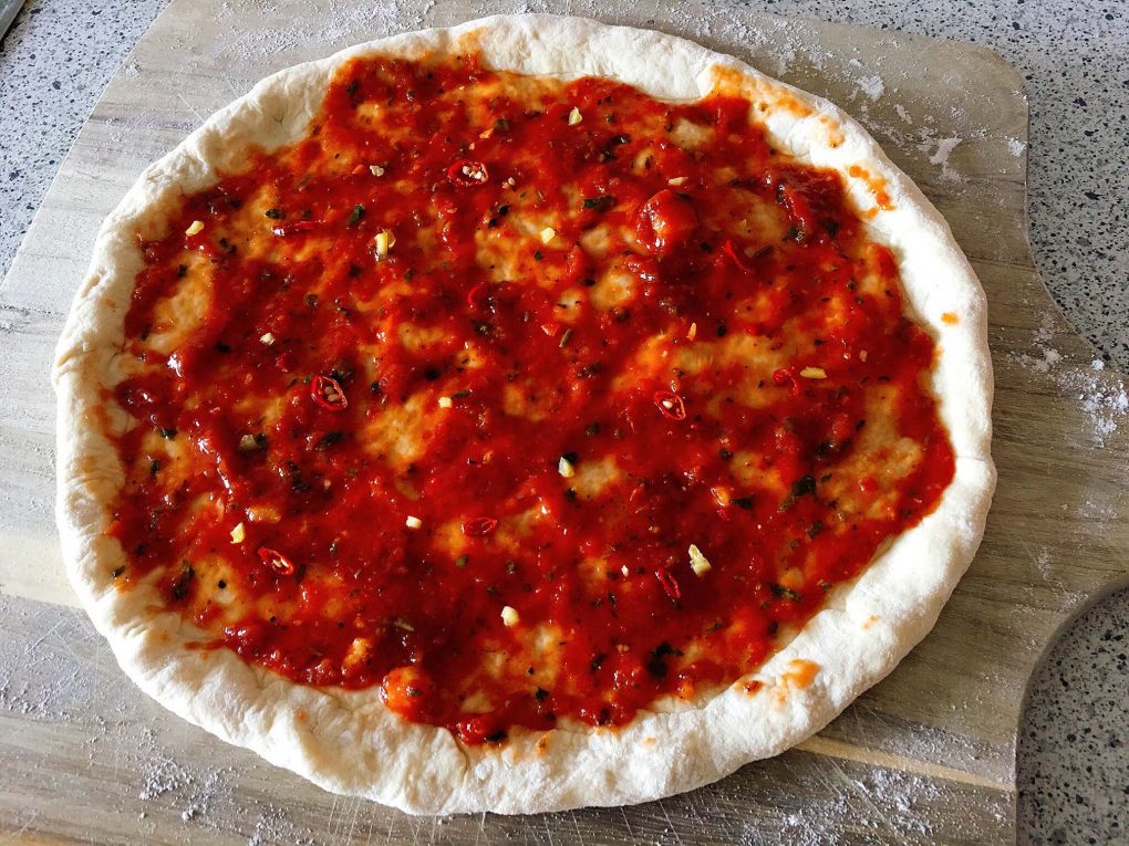 Pizza with tomato sauce